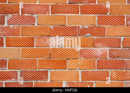 Background of old red and dotted brick wall texture, abstract architecture wallpaper Stock Photo