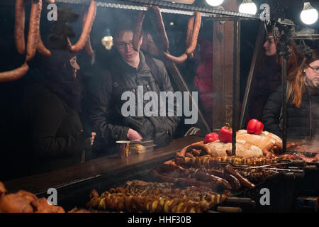People visit Christmas market at main square in old city Stock Photo