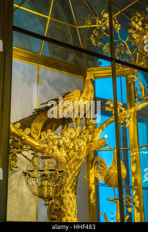 SAINT PETERSBURG, RUSSIA - DECEMBER 25, 2016: The Peacock Clock, large automaton featuring three life-sized mechanical birds in Hermitage Stock Photo