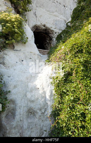 Remnants of wartime Caves from WWII era at the base of the chalk cliffs at St Margaret's Bay, Kent. Stock Photo