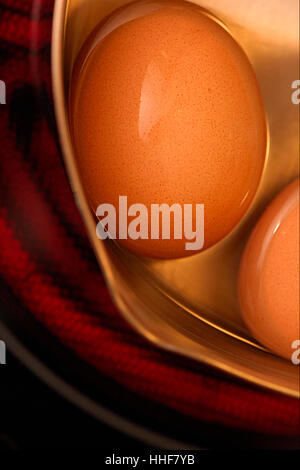 Eggs in a pan on electric hob Stock Photo