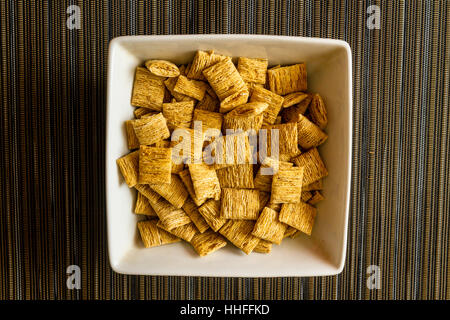 A bowl of shredded wheat breakfast cereal Stock Photo