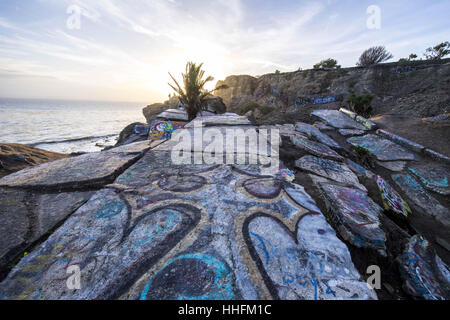 San Pedro, USA. 16th Jan, 2017. The area of abandoned roads and suburban development is a popular place to watch the sunset on the Palos Verdes Peninsula. The area is technically off limits to the public but graffiti artists and beachgoers alike crowd the area on weekends. Credit: Stuart Palley/ZUMA Wire/Alamy Live News Stock Photo