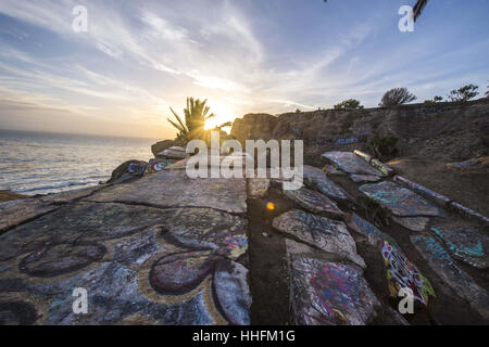 San Pedro, USA. 16th Jan, 2017. The area of abandoned roads and suburban development is a popular place to watch the sunset on the Palos Verdes Peninsula. The area is technically off limits to the public but graffiti artists and beachgoers alike crowd the area on weekends. Credit: Stuart Palley/ZUMA Wire/Alamy Live News Stock Photo