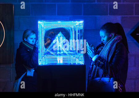 London, UK. 18th Jan, 2017. Visitors interact with colourful light installations at Crossrail Place Level -3. Winter Lights comprises 30 light installations, sculptures and structures by innovative artists and designers throughout Canary Wharf. The visual spectacle is free to visitors and runs until 27th January. Credit: Imageplotter News and Sports/Alamy Live News Stock Photo