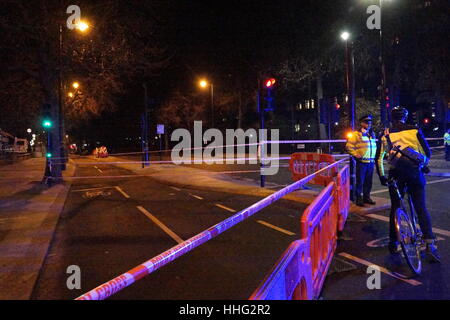 London, UK. 19th Jan, 2017. A suspected WWII unexploded bomb found during marine engineering works has closed the Embankment on the River Thames between Westminster and Embankment tube stations, outside the National Liberal Club in Whitehall Place. Police sources said it was ' a public safety issue' whilst a nearby workman said that it was believed that an unexploded bomb from WWII had been found in the river. Traffic was diverted and cyclists were denied use of their super highway in the name of safety. Credit: Peter Hogan/Alamy Live News Stock Photo