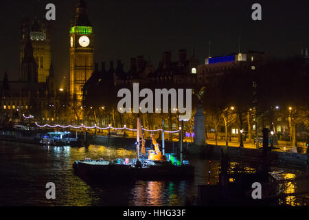 Embankment, London, UK. 19th Jan, 2017. Police seal off Victoria Embankment near the Houses of Parliament, following the discovery of an unexploded World War II bomb by construction workers. Two of London's busiest stations were temporarily evacuated and both Westminster and Waterloo bridges were closed for a short time. PICTURED: Big Ben towers over the river and the construction barge from which the unexploded bomb appears to have been discovered. Credit: Paul Davey/Alamy Live News Stock Photo
