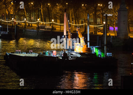 Embankment, London, UK. 19th Jan, 2017. Police seal off Victoria Embankment near the Houses of Parliament, following the discovery of an unexploded World War II bomb by construction workers. Two of London's busiest stations were temporarily evacuated and both Westminster and Waterloo bridges were closed for a short time. PICTURED: The construction barge from which the unexploded bomb appears to have been discovered. Credit: Paul Davey/Alamy Live News Stock Photo
