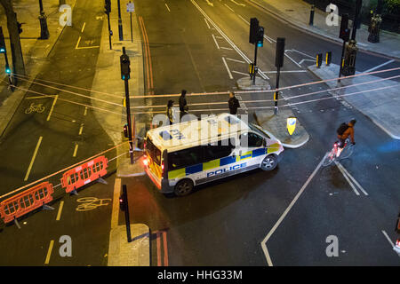 Embankment, London, UK. 19th Jan, 2017. Police seal off Victoria Embankment near the Houses of Parliament, following the discovery of an unexploded World War II bomb by construction workers. Two of London's busiest stations were temporarily evacuated and both Westminster and Waterloo bridges were closed for a short time. PICTURED: Police cordon at Victoria Embankment near Hungerford Bridge. Credit: Paul Davey/Alamy Live News Stock Photo