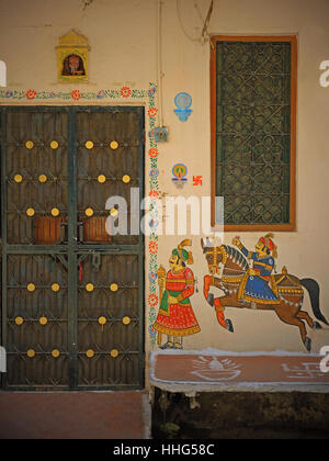 Wall art on a building in the center of Udaipur, India, displaying a level of detail characteristic of Indian miniature painting Stock Photo