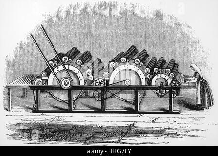 Illustration depicting a carding engine. Carding is the process that disentangles; cleans; and intermixes the woollen fibres. Dated 19th Century Stock Photo