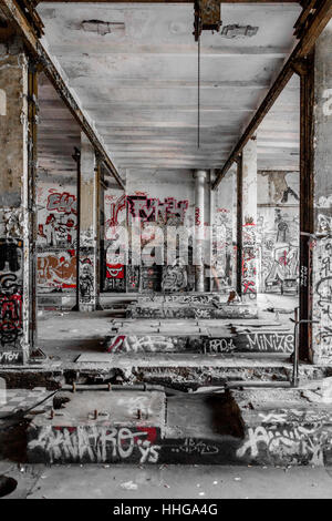 Empty room in abandoned factory ruin - run down building Stock Photo