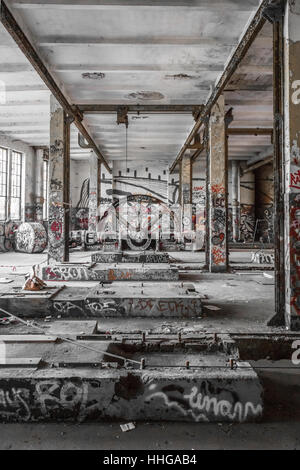 Empty room in abandoned factory ruin - run down building Stock Photo