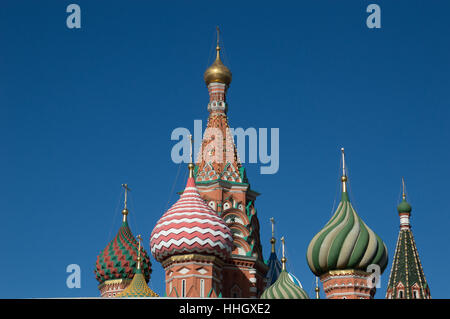 The ornate red brick exterior and colorful onion domes of St. Basil's Cathedral, a Russian Orthodox Church on Red Square. Stock Photo