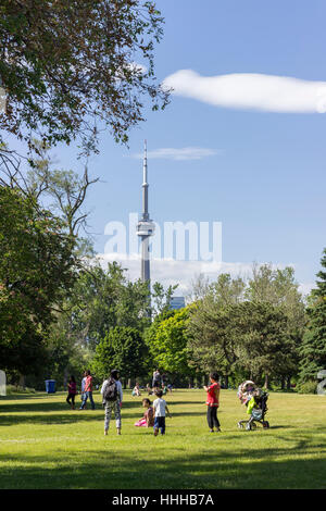 TORONTO, CANADA - Families enjoying a sunny summer day in the Toronto Islands with the CN Tower in the background Stock Photo