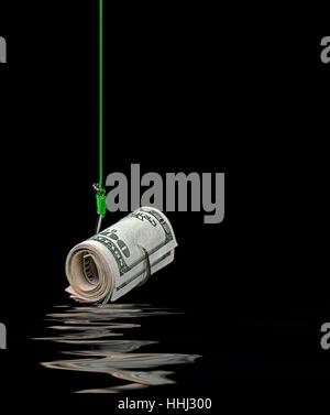 roll of American money on fish hook with water reflection Stock Photo