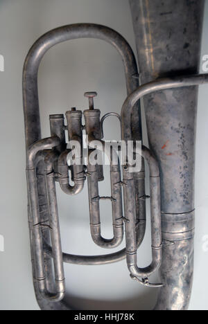 A vintage brass trumpet on a white table top, Portsmouth, Hampshire, UK. Stock Photo