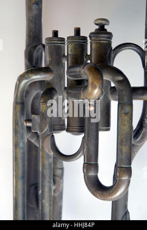 A vintage brass trumpet on a white table top, Portsmouth, Hampshire, UK. Stock Photo