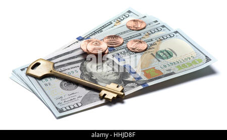 House key over the hundred dollar banknotes isolated on white background Stock Photo