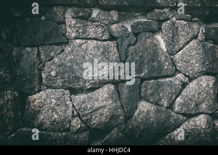 old cracked natural stone wall background texture Stock Photo