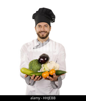 smiling chef with vegetables in hands isolated on white Stock Photo