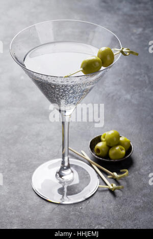 Martini cocktail on dark stone table Stock Photo