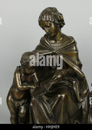 Antique French Bronze Mother and Child Reading Stock Photo