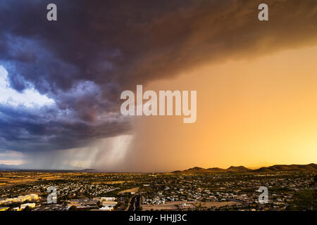 Dramatic clouds and sky from a summer thunderstorm approaching Tucson, Arizona at sunset Stock Photo