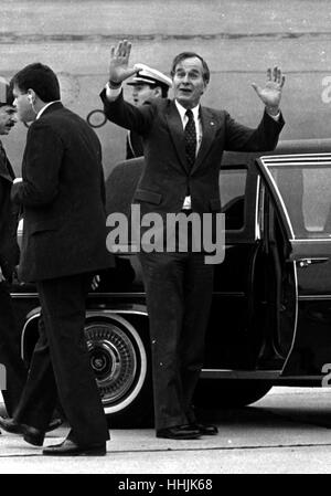 US Vice President George H Bush waves to the press being held back at Dallas' Love Field in 1984 photo by bill belknap Stock Photo