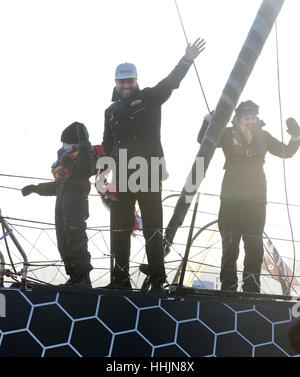 British sailor Alex Thomson celebrates with his son Oscar and wife Kate on deck as he comes in second in the Vendee Globe race at Les Sables d'Olonne, western France. Stock Photo