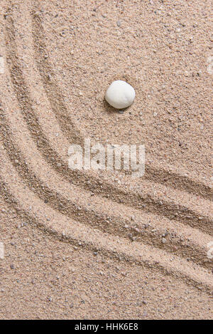 zen garden sand waves and rock sculptures Stock Photo