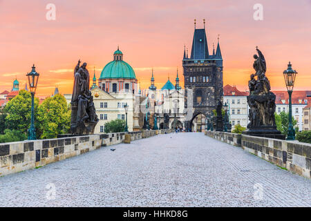 Prague, Czech Republic. Charles Bridge (Karluv Most) and Old Town Tower at sunrise. Stock Photo