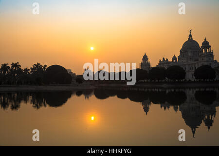 Silhouette sunrise view of Victoria Memorial architectural building monument and museum at Kolkata, India. Stock Photo