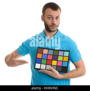 Bearded guy holds a Color and grayscale control table. Isolated over white Stock Photo