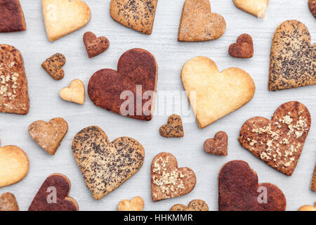Love concept. Variety of heart cookies on grey rustic background Stock Photo
