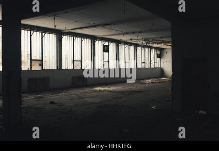 Interior of an old factory, abandoned and ruined building. Stock Photo