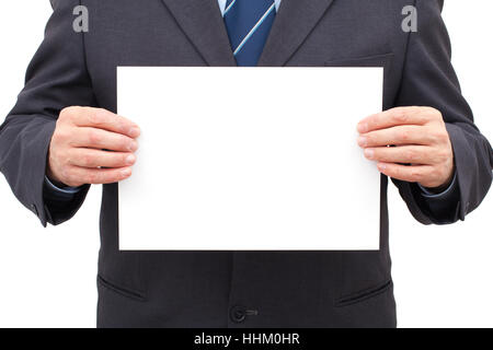 Businessman in suit holding a blank white sheet in his hands. Stock Photo