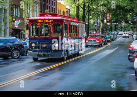 Free trolley transportation on beautiful tree-lined Main Street in historic downtown Greenville, South Carolina, USA. Stock Photo
