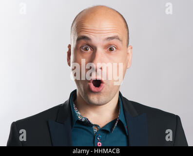 shocked bald guy expressive portrait. Studio shot Stock Photo
