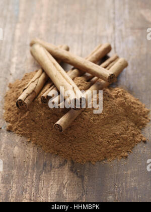 ceylon cinnamon sticks and powder on wooden background Stock Photo