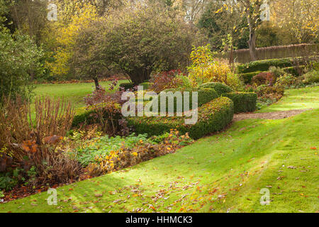 Fawley House Garden. November 2016. Tiered 2.5 acre garden with lawns, mature trees, formal hedging, stream and gravel pathways. Stock Photo
