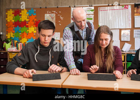 Internet based learning of foreign languages via wlan with tablets in a grammar school. Stock Photo