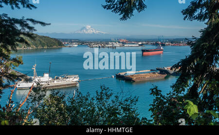 A panoramic shot of the Port of Tacoma with majestic Mount Rainier in ...