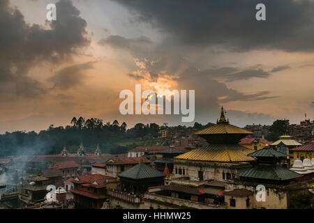 Sunset over the buildings of Pashupatinath temple, the banks of Bagmati River, Kathmandu, Kathmandu District, Nepal Stock Photo