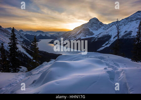 Dramatic Winter Sunset Sky over Spray Lakes and Distant Snowy Rocky Mountains Landscape in Kananaskis Country Alberta Foothills, Canada Stock Photo