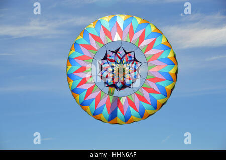This is a photo of a sombrero kite flying in a blue sky Stock Photo