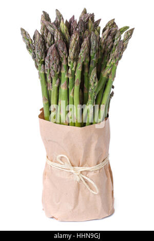 Fresh asparagus in paper packing isolated on a white background closeup Stock Photo
