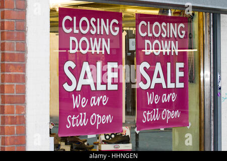 Closing Down Sale Shop Window poster   We are still open, Manchester, UK Stock Photo