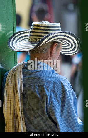 October 2, 2016, El Jardin, Colombia: a local man wearing a traditional straw hat called sombrero vueltiao and folded poncho over the shoulder Stock Photo