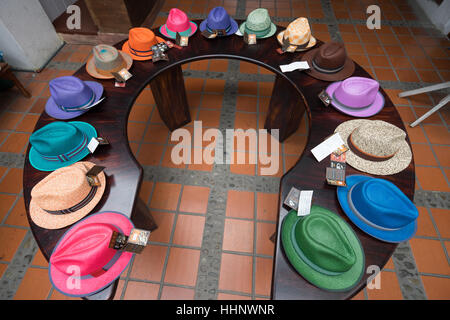 July 21, 2016 Cuenca, Ecuador: colorful Panama hats on display on a round table in the straw hat museum in the centre of the city Stock Photo